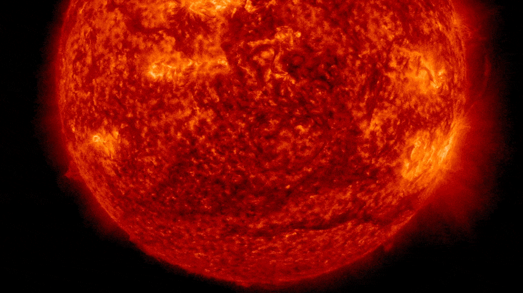 Looped video footage showing a giant dark plasma plume being ejected from the sun