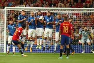 Isco scores a free-kick for Spain against Italy in a World Cup qualifier in 2017.