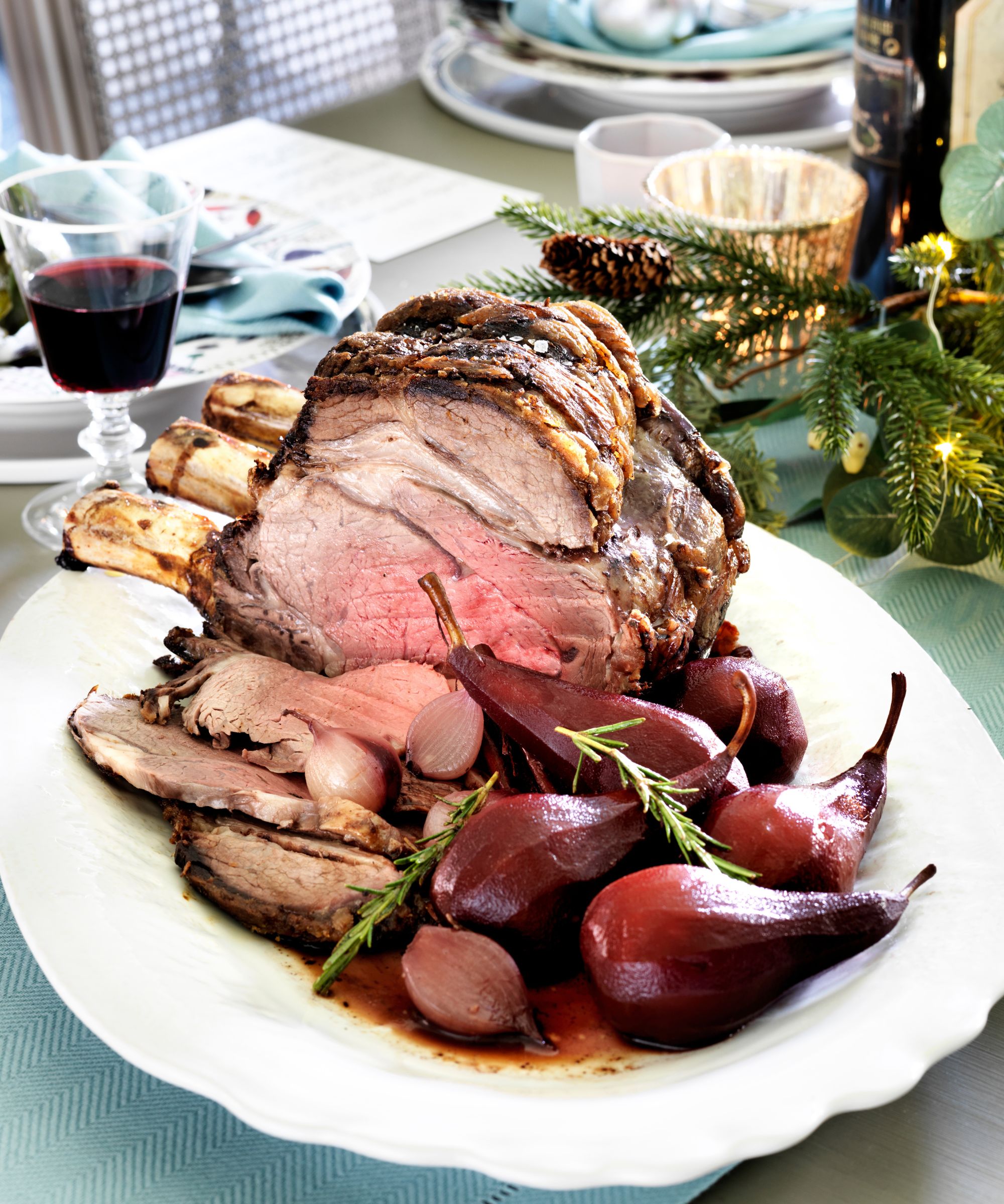 Roast meat on a plate with cooked pears