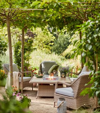 garden area with bamboo and armchair with fire pit table