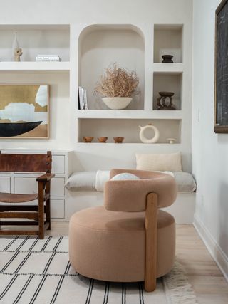 Neutral living room with arched shaped shelving