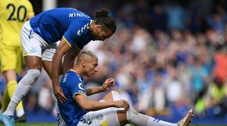 Dominic Calvert-Lewin helps Richarlison to get up during Everton's Premier League game against Brentford.