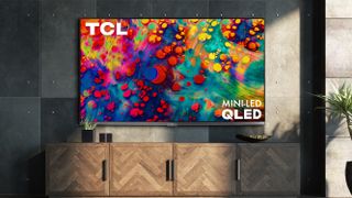 The TCL 6-Series TV on a living room wall.