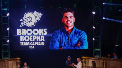 Brooks Koepka pictured on a screen at a LIV Golf launch party