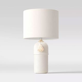 Ceramic white table lamp on white background