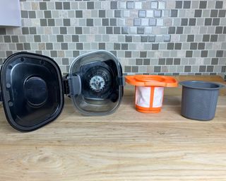 Black and Decker Dustbuster handheld vacuum filters removed and placed on kitchen countertop