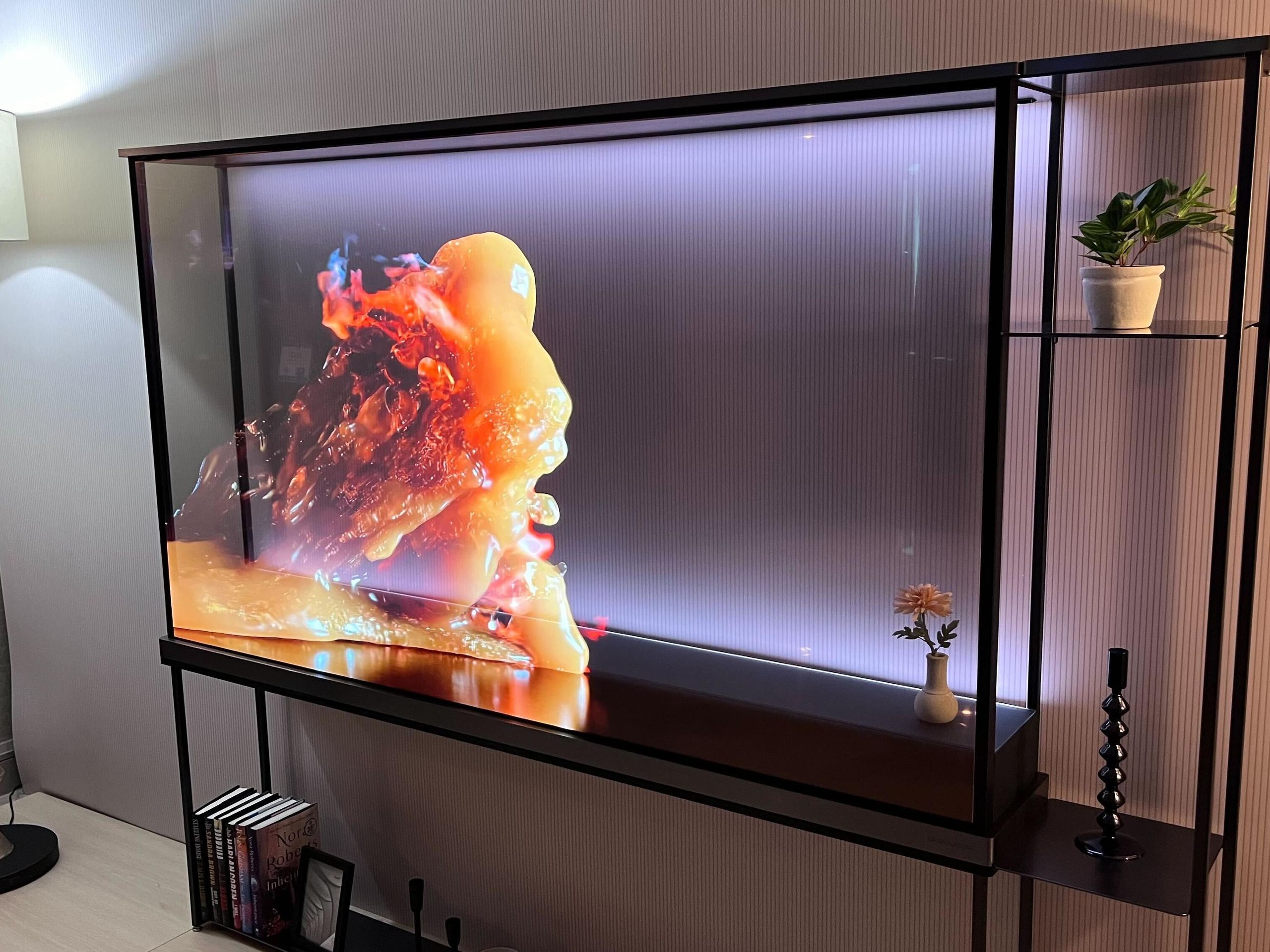LG Signature OLED T transparent OLED television in modern living room.