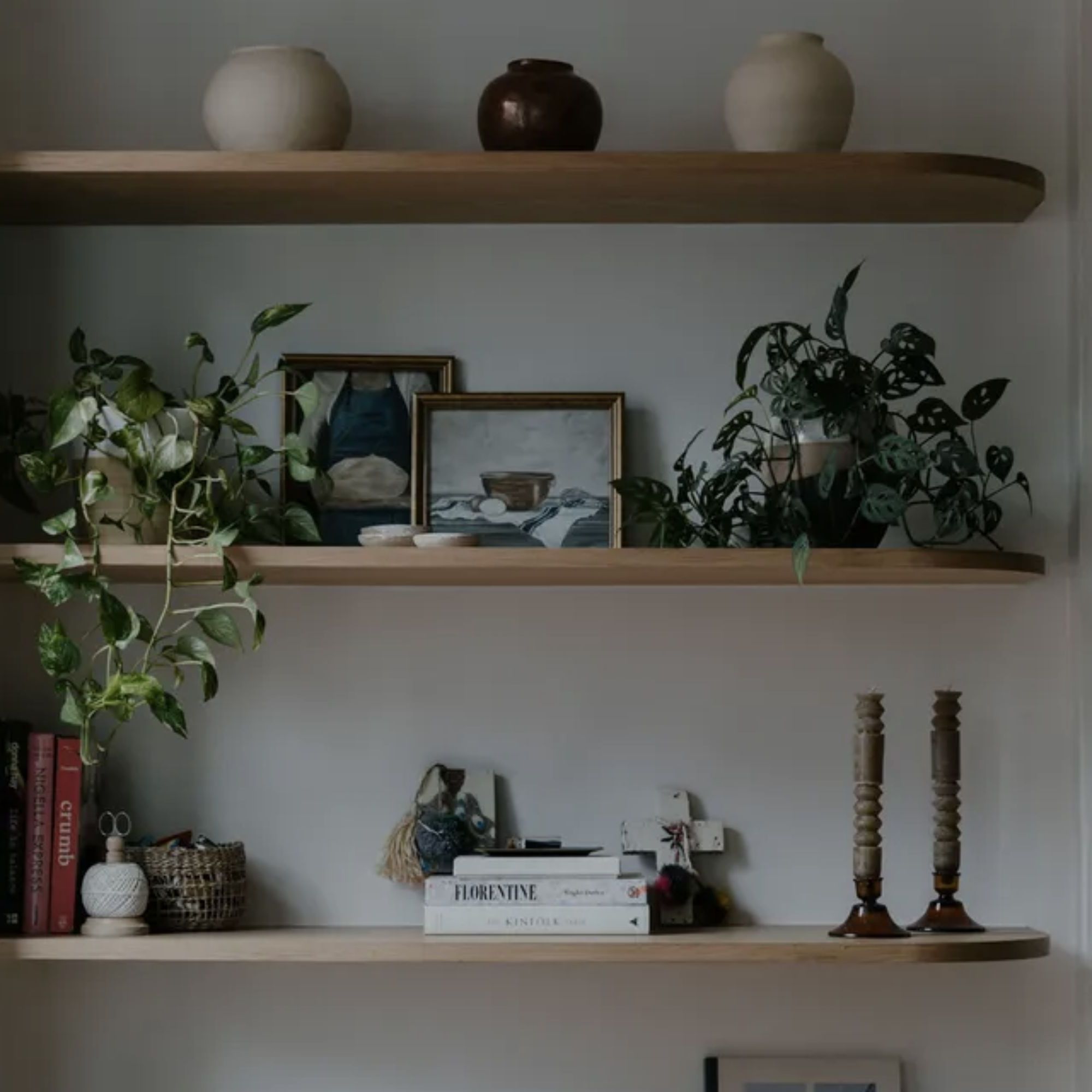 Minimal floating shelf styling with clean balanced decor and open space.