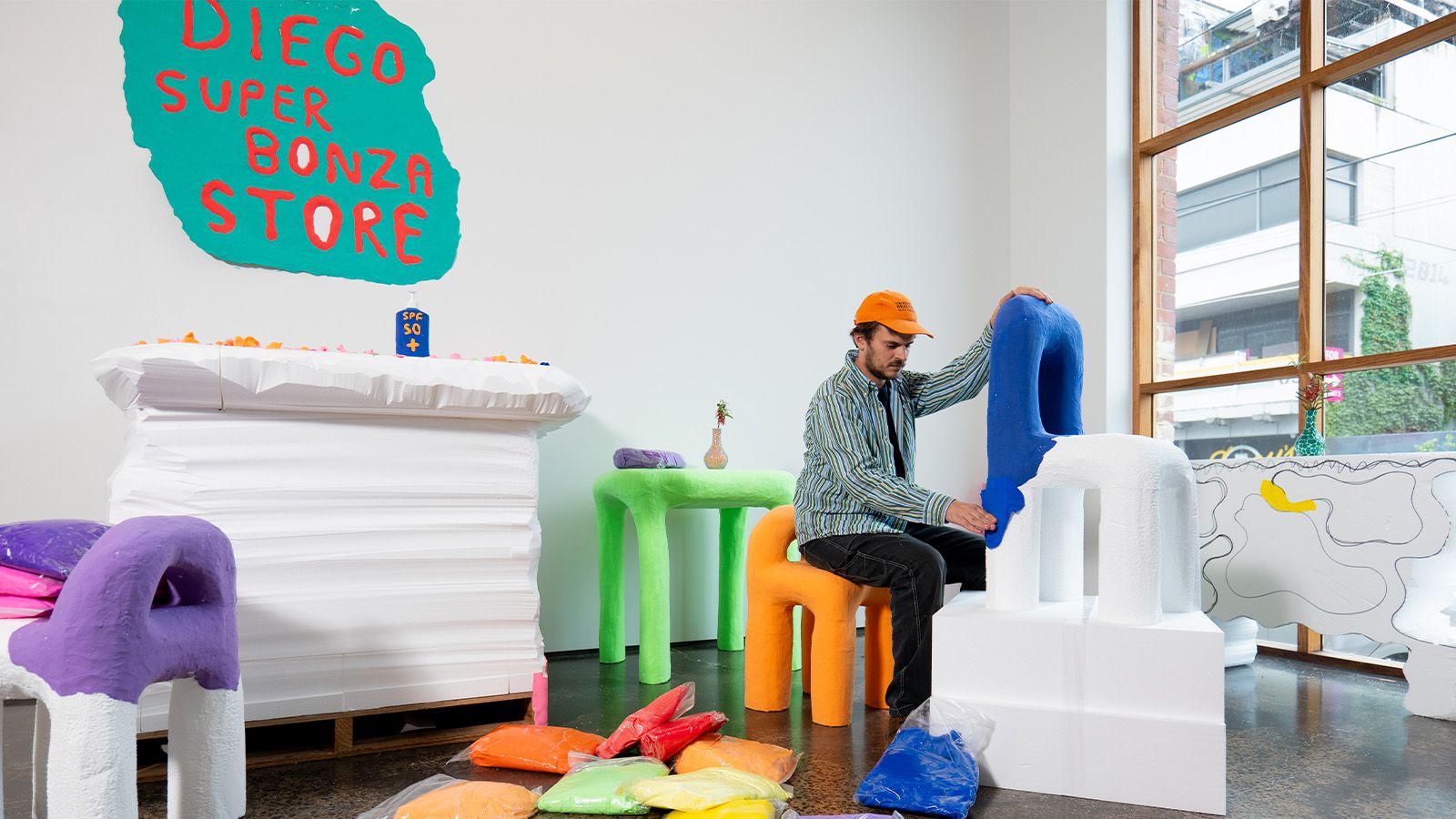 man in play-doh design installation