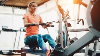 Woman using a rowing machine at a fitness center