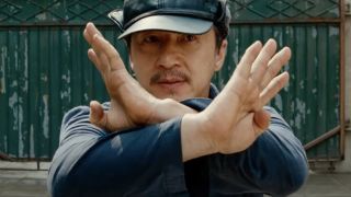 Jackie Chan as Mr. Han fighting off kids in The Karate Kid (2010).