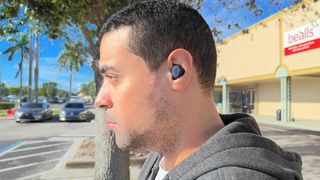 Man wearing the Jabra Elite 8 Active while training outdoors