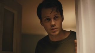 Bill Skarsgård answering the door in a very chill manner in Barbarian.