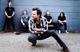 Pearl Jam posing for a photograph in 2013