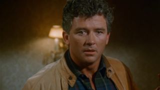 Patrick Duffy stands in a doorway looking shocked in the Dallas series finale.