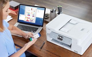 A person printing from an iPhone to a Brother laser printer