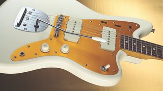 Signature Fender guitar on a gold background