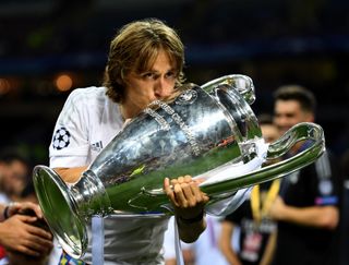 Luka Modric kisses the Champions League trophy after Real Madrid&#039;s win over Atletico Madrid on penalties in the 2016 final.