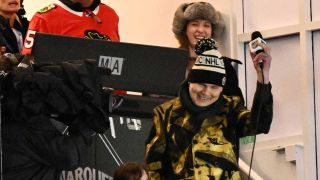 Billy Corgan singing in a broadcasting booth at Wrigley Field