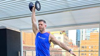 Andy Speer performing a dumbbell overhead press