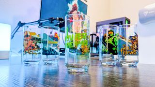 IHOP Xbox glasses standing upright and splayed out on a desk. 