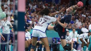 Norway&#039;s centre back Stine Bredal Oftedal (R) shoots ahead of the EHF Euro 2024 women&#039;s handball tournament