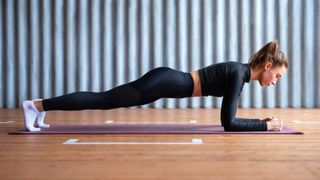 a photo of a woman doing a plank 