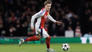 A shot of Martin Odegaard of Arsenal running with the ball in a match ahead of Arsenal vs Everton in the Premier League