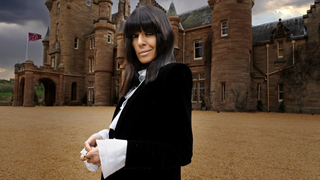 The Traitors UK season 3 host Claudia Winkleman standing in front of Ardross Castle