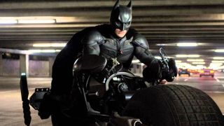 Christian Bale as Batman riding the Batpod in The Dark Knight Rises