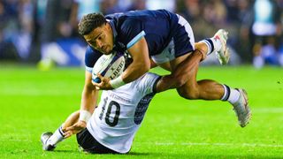 Scotland&#039;s Sione Tuipulotu is tackled by Fiji&#039;s Caleb Muntz in the November 2024 Autumn International