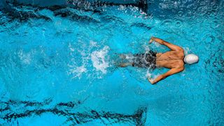 A man swimming in a pool