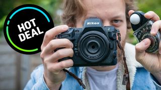 Man holding Nikon Z8 and Sekonic Studio Deluxe III light meter, with &#039;Hot Deal&#039; roundel on the left