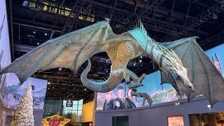 A model of a dragon hanging from the ceiling of the lobby of the Harry Potter Studio Tour