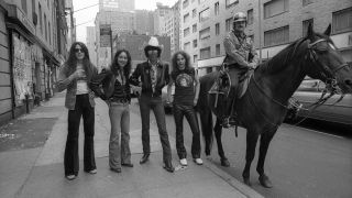 Thin Lizzy posed in New York City street in 1977 with a policeman on a horse