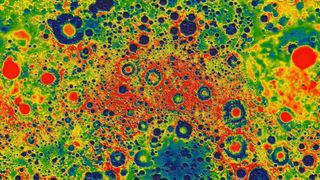 An image of the Moon&#039;s cratered surface in rainbow colors