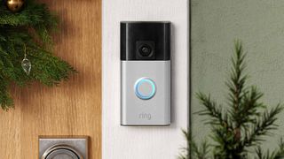 A Ring doorbell outside during the winter