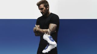 David Beckham holding a pair of Adidas Original Predators