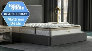 The Saatva Memory Foam Hybrid mattress on a bed frame in a bedroom, a Tom&#039;s Guide Black Friday mattress deals graphic (left)