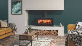 A contemporary inset log burner in a lounge