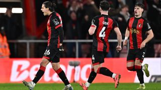 Three Bournemouth players celebrate a goal against West Ham