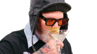 Fred Durst sipping out of a martini glass