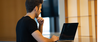 Man using laptop in office