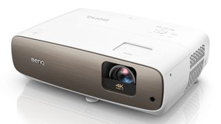 A white BenQ projector on a white background. It has rounded corners and says 4K on the lens in the front right corner.