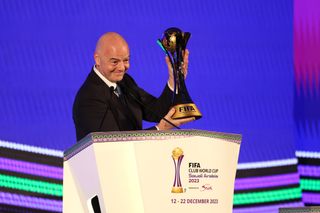 FIFA President, Gianni Infantino raises the FIFA Club World Cup trophy