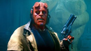 Ron Perlman holding gun as Hellboy