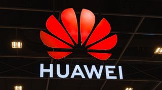 A large LED Huawei logo, taken with a telephoto lens on the conference floor at Huawei Cloud Summit France.