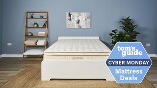 Image shows the Saatva Classic mattress on a white bed frame with a blue Cyber Monday deals badge overlaid on the bottom right