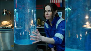 Rose (Emily Hampshire) looks at some containers full of water in Prime Video&#039;s &quot;The Rig&quot; season 2