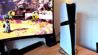 PS5 Pro next to monitor with Ratchet and Clank: Rift Apart gameplay on screen